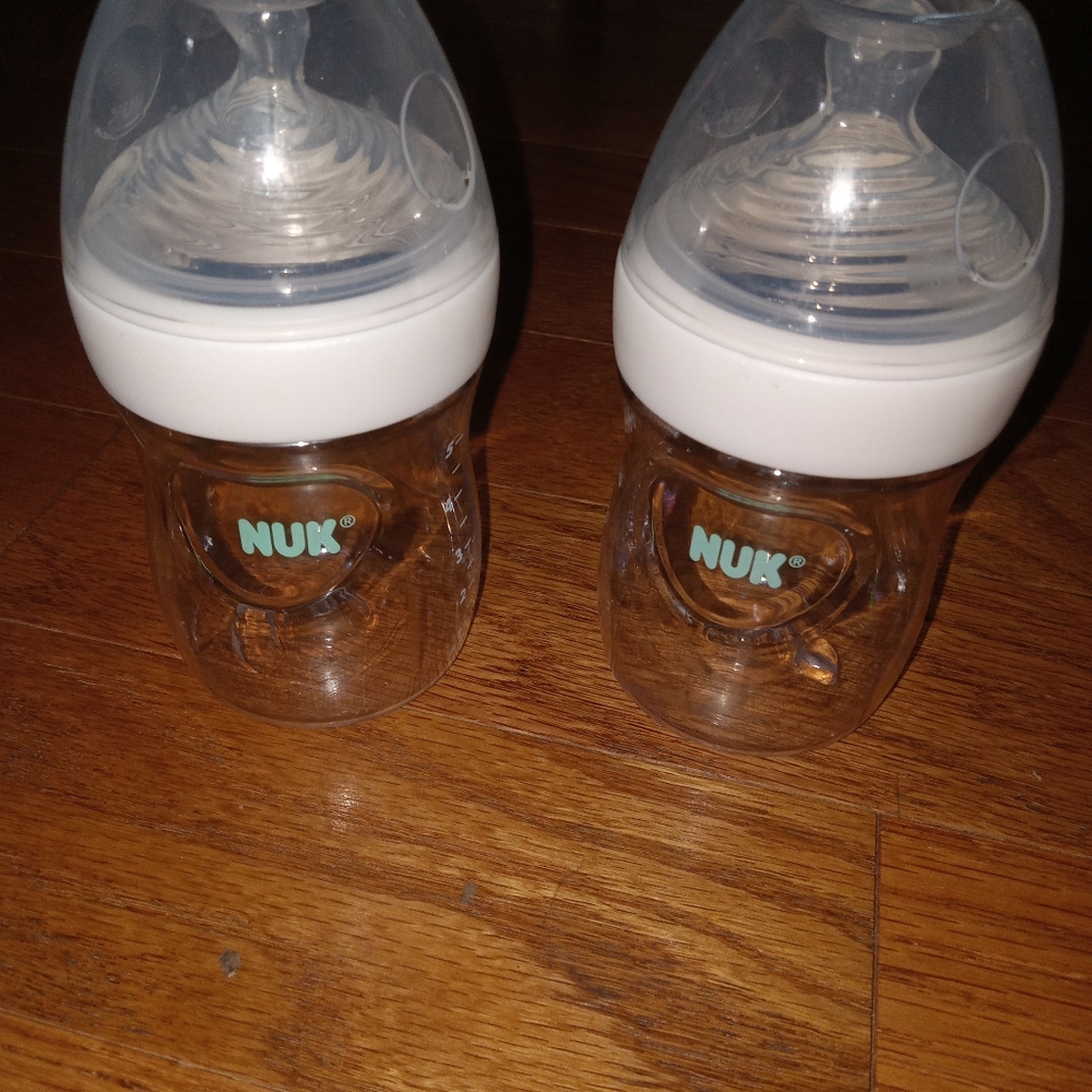 2 5oz Nuk baby bottles with lids